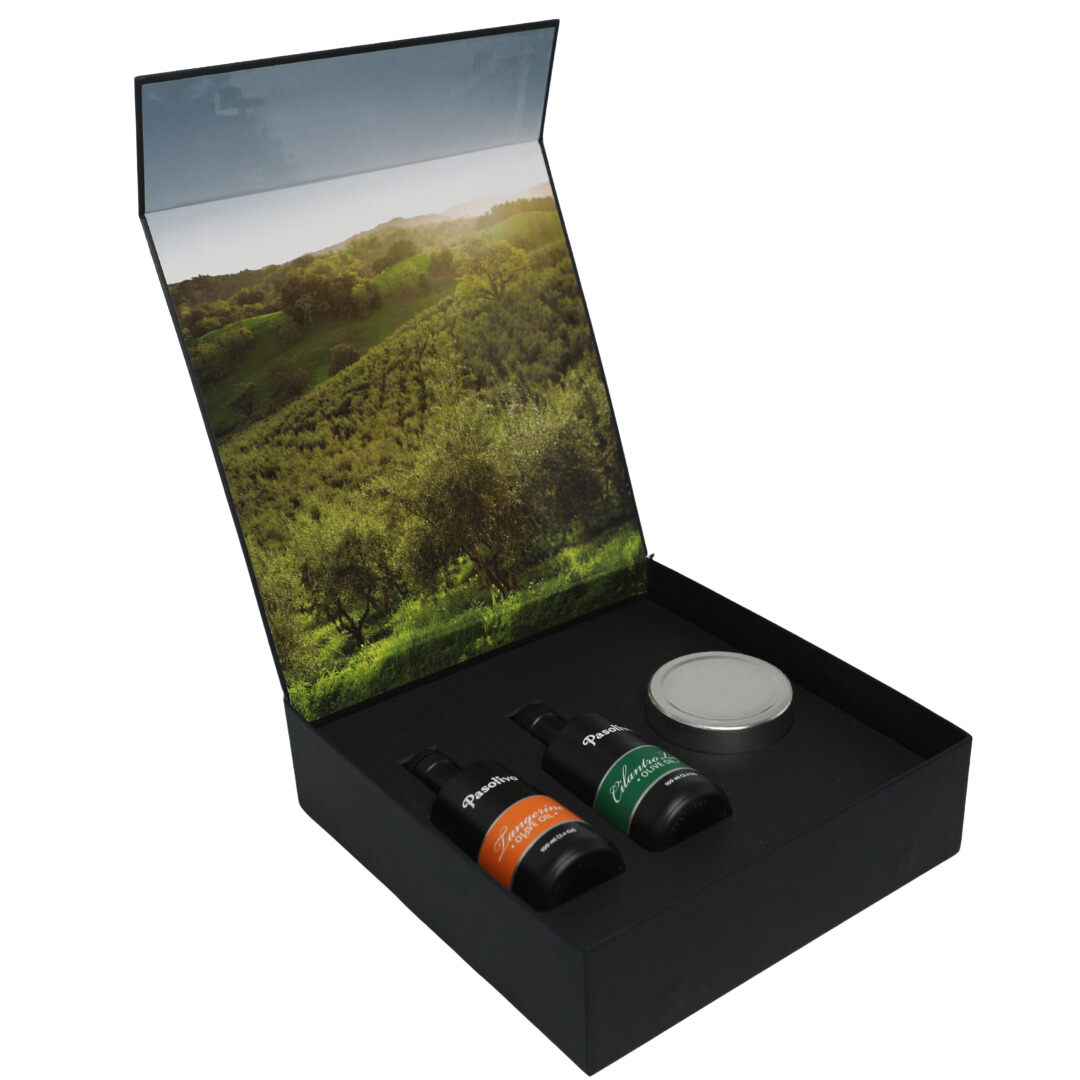 Premium Pasolivo products packaged in beautiful black box with green olive orchard imagery.