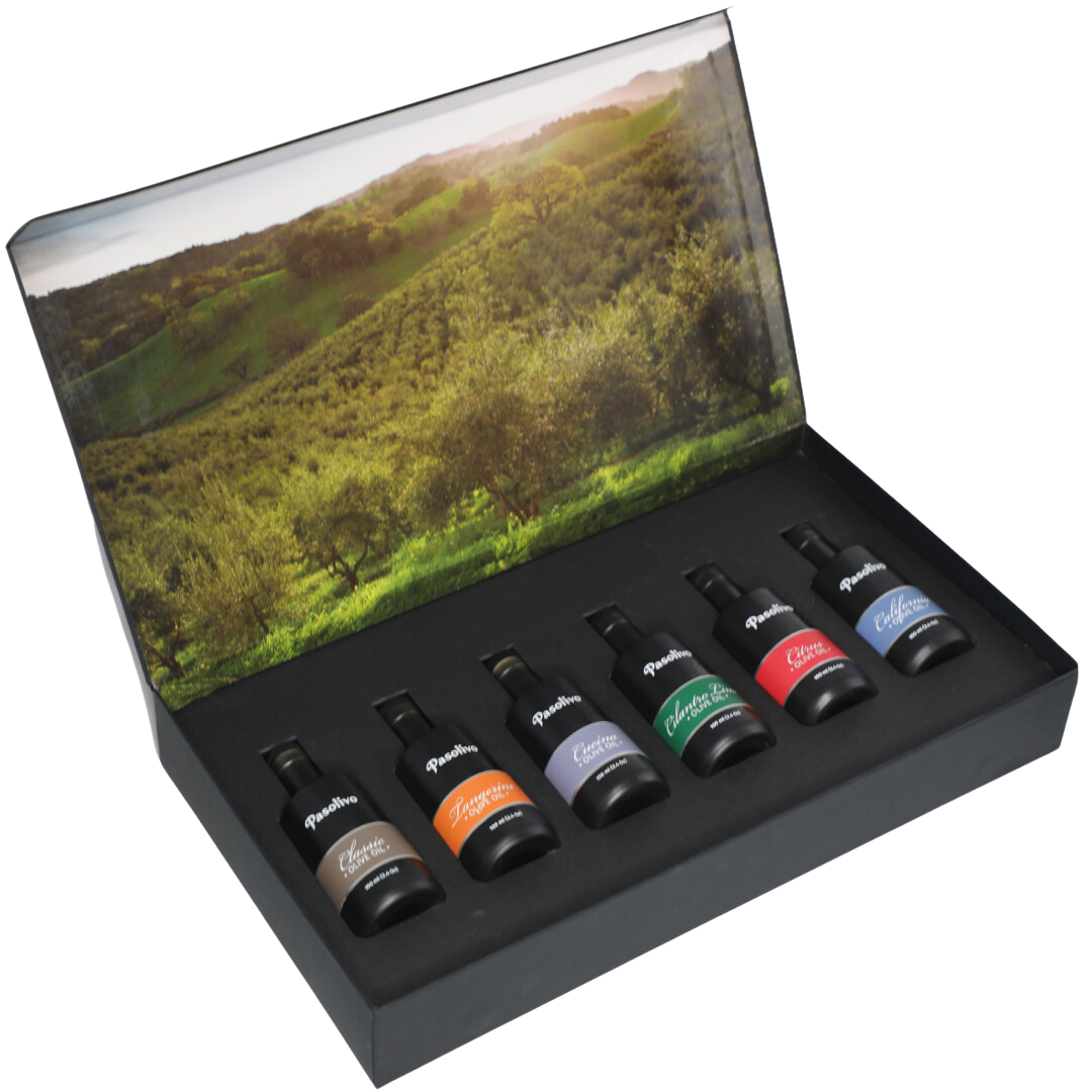Premium Pasolivo products packaged in beautiful black box with green olive orchard imagery.