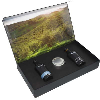 Premium Pasolivo products packaged in beautiful black box with green olive orchard imagery.