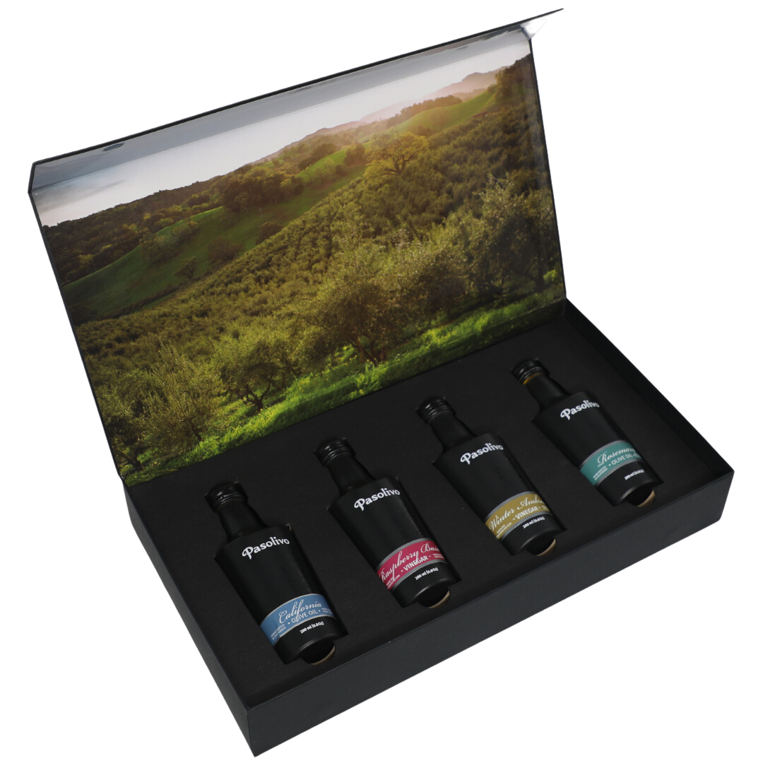 Premium Pasolivo products packaged in beautiful black box with green olive orchard imagery.