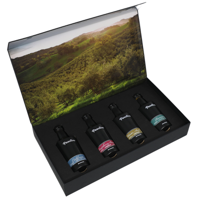 Premium Pasolivo products packaged in beautiful black box with green olive orchard imagery.