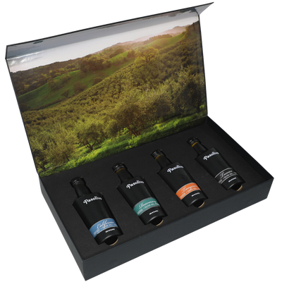 Premium Pasolivo products packaged in beautiful black box with green olive orchard imagery.