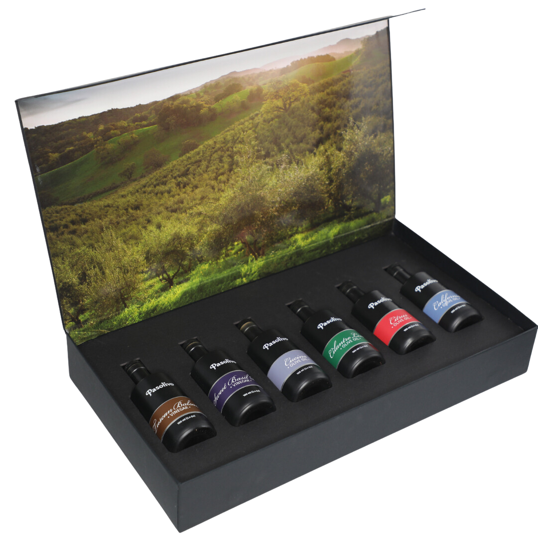 Premium Pasolivo products packaged in beautiful black box with green olive orchard imagery.
