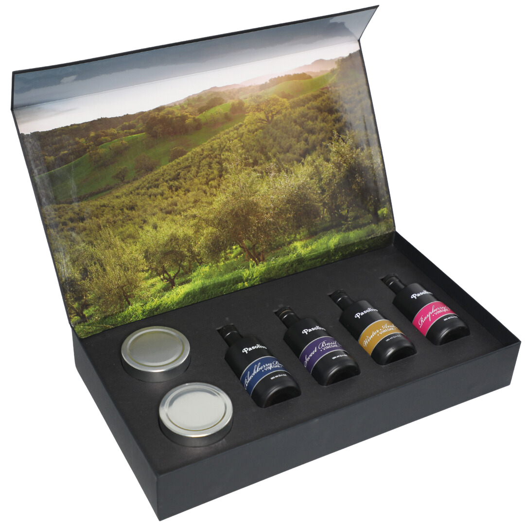 Premium Pasolivo products packaged in beautiful black box with green olive orchard imagery.