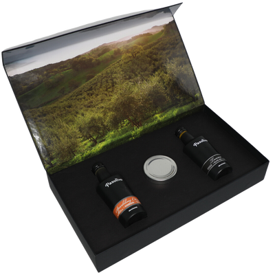 Premium Pasolivo products packaged in beautiful black box with green olive orchard imagery.