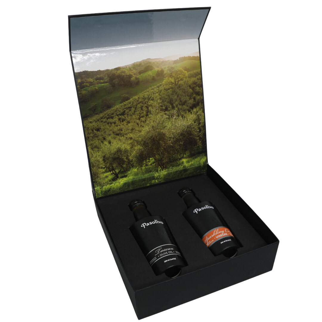 Premium Pasolivo products packaged in beautiful black box with green olive orchard imagery.