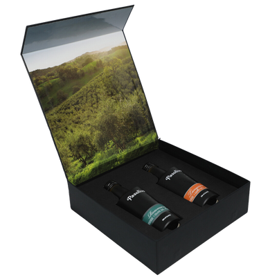 Premium Pasolivo products packaged in beautiful black box with green olive orchard imagery.