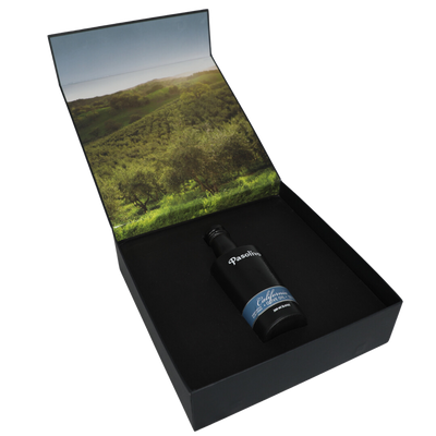 Premium Pasolivo products packaged in beautiful black box with green olive orchard imagery.