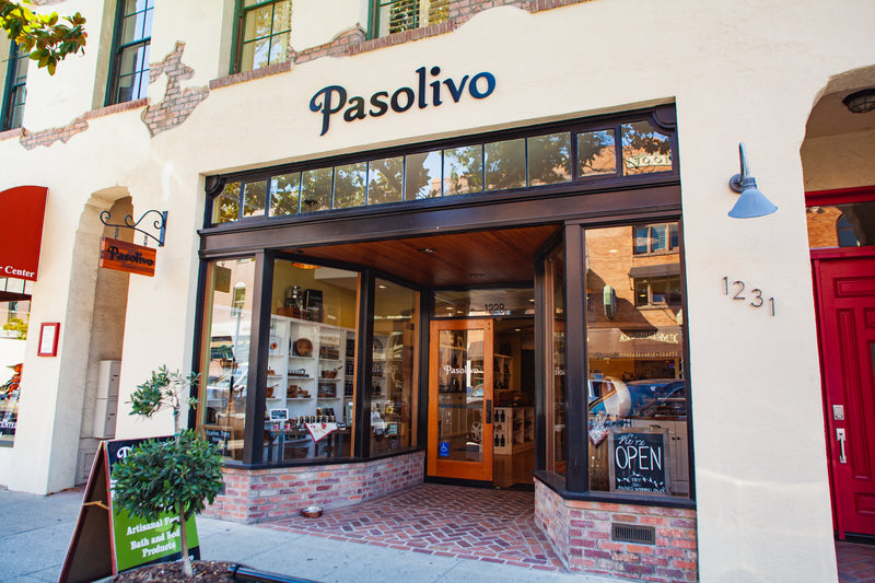 Storefront of Pasolivo with 'Open' sign visible