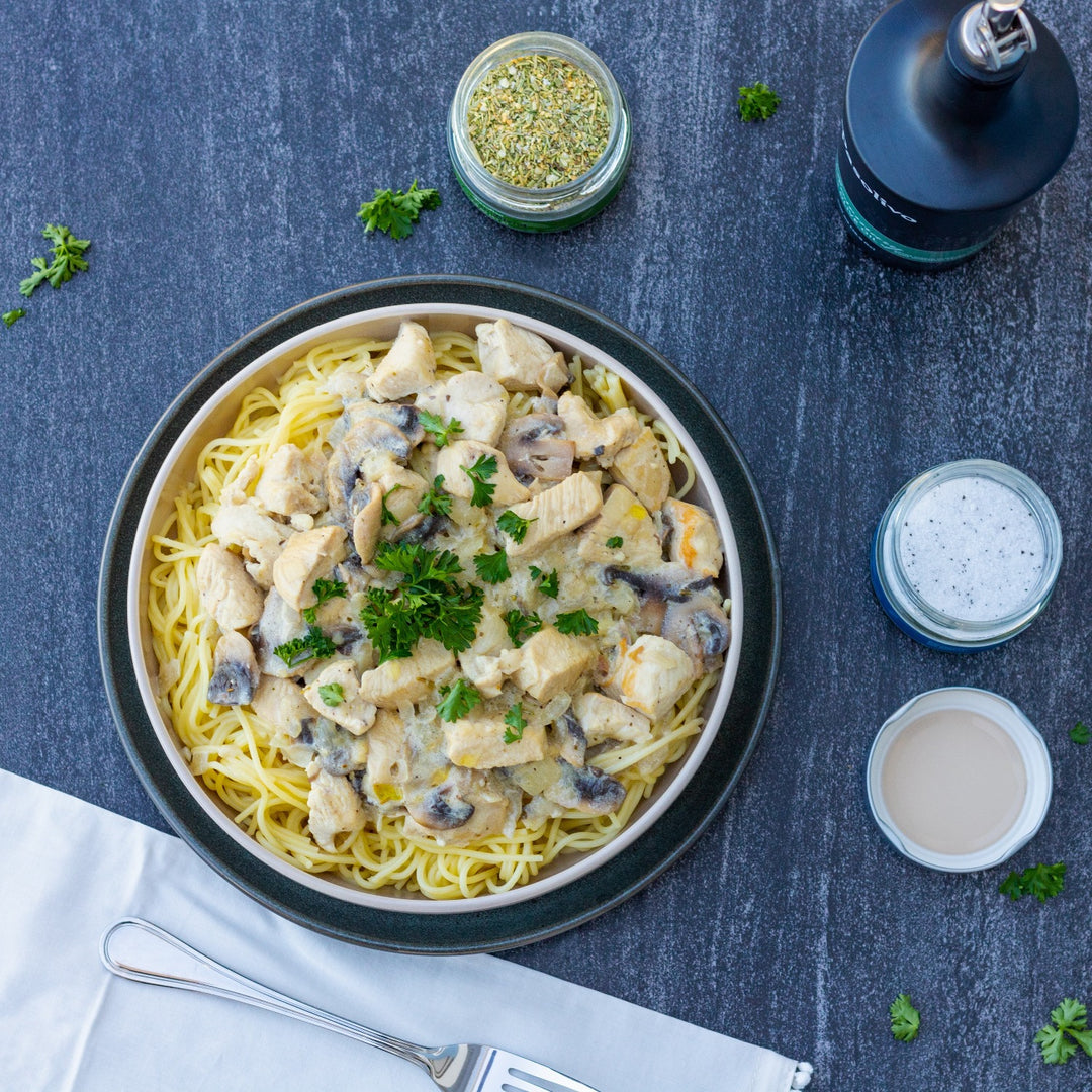 Pasolivo Chicken Stroganoff Recipe plated next to our Rosemary Olive Oil
