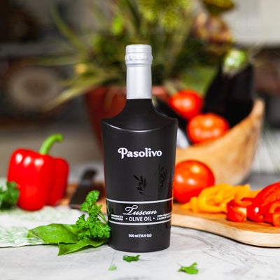 Bottle of Pasolivo olive oil with vegetables in the background